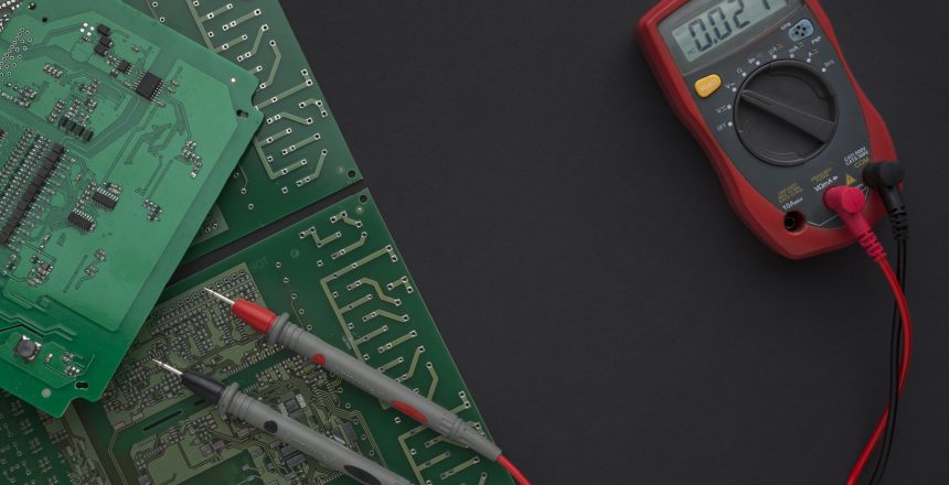 close-up-circuit-board-with-multimeter